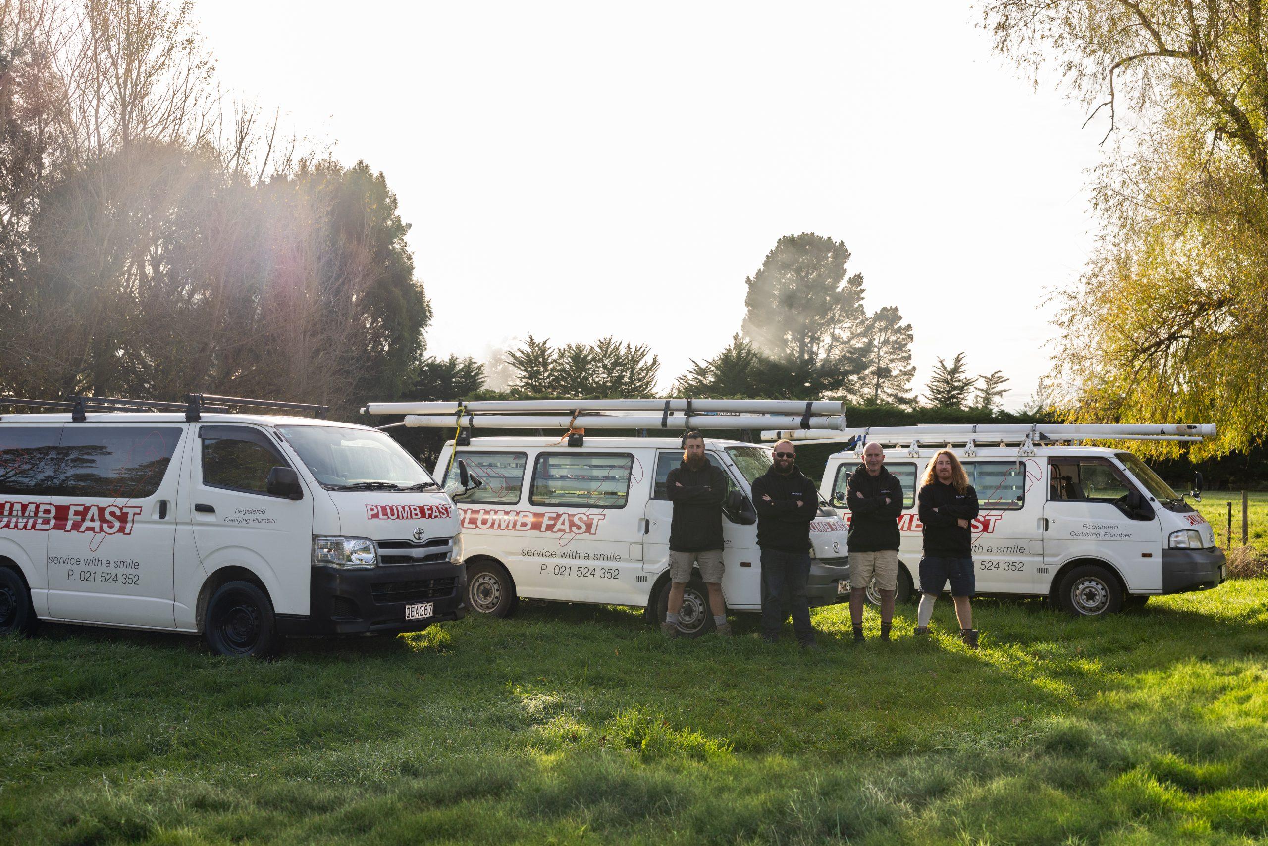 The Plumbfast team with their fleet of four service vans